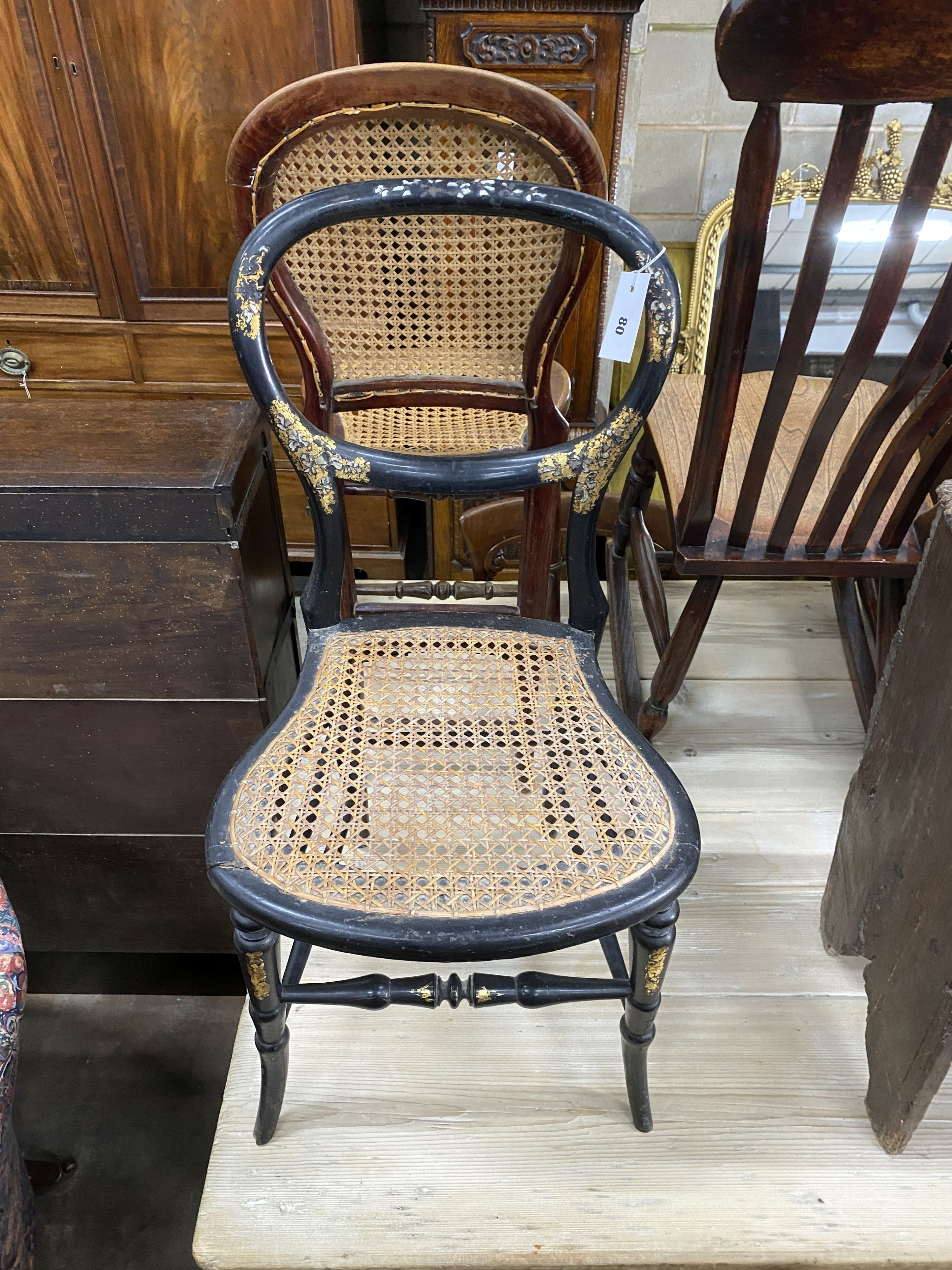 A Victorian elm and beech rocking chair together with two Victorian caned seat chairs